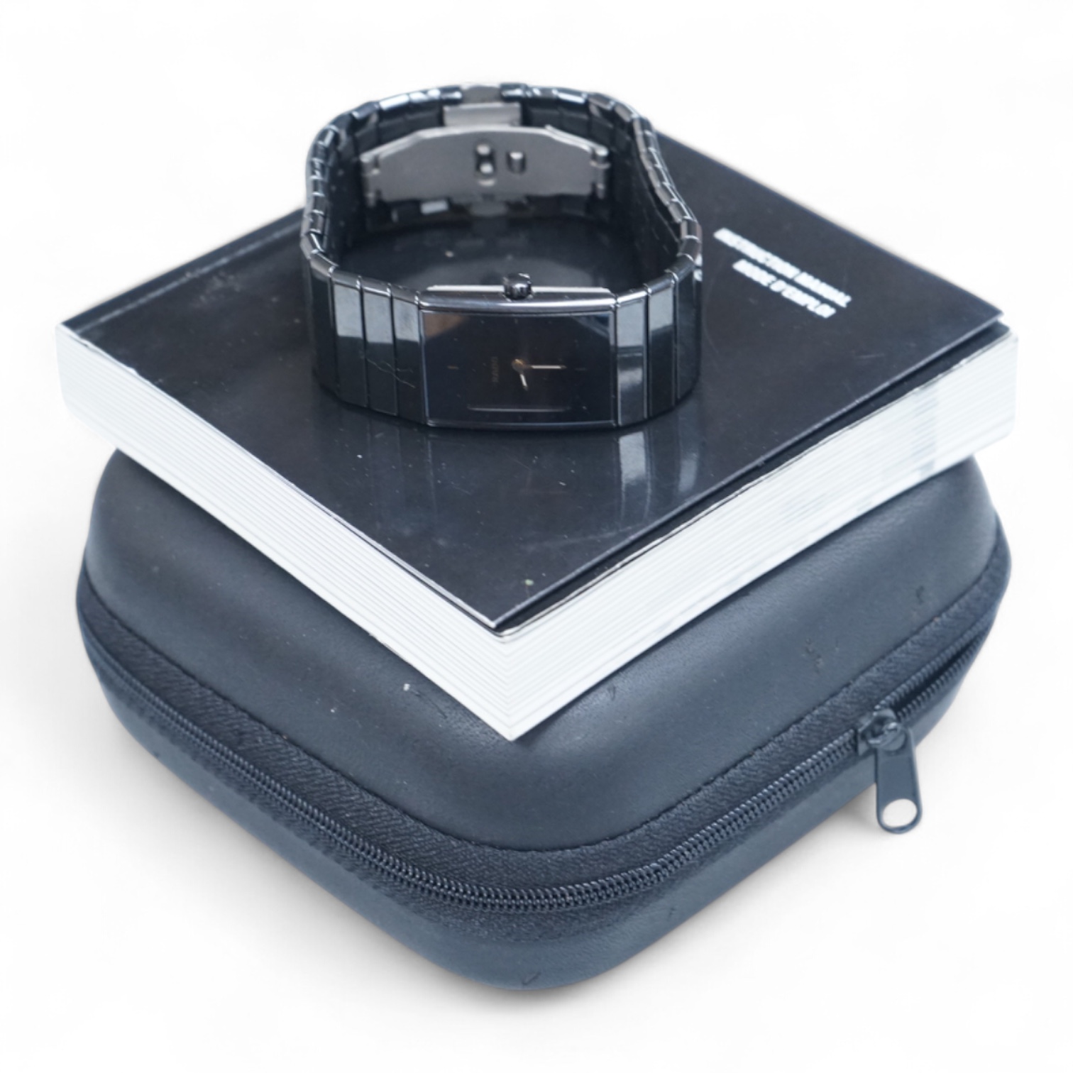 A modern Swiss titanium and ceramic Rado Diastar quartz wrist watch, with rectangular dial and dot markers, case diameter 25mm, with Rado box and booklet.